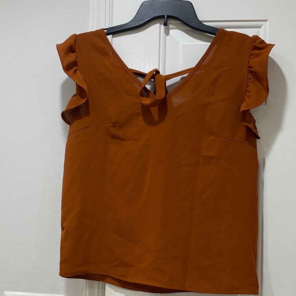 Shein, women’s size XS, rust color blouse.
